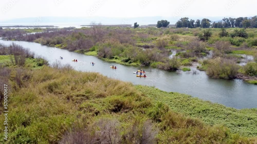 Sea of Galilee, Israel - 4 November 2022: Aerial view of people kayaking in a lake. Sea of Galilee, Israel - 4 November 2022: Aerial view of people kayaking in a lake.