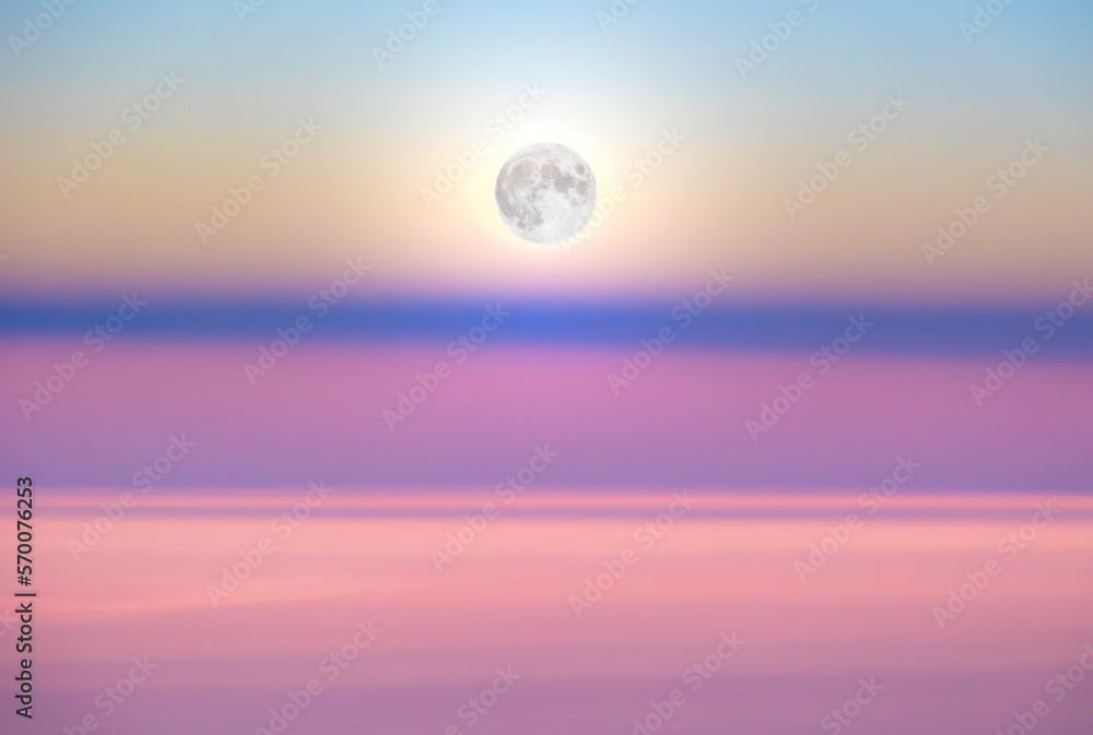 Moonrise above the shadow of the earth in pink morning sky Moonrise above the shadow of the earth in pink morning sky