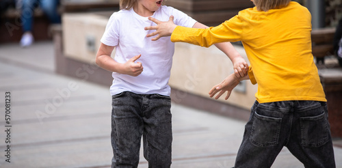 Children fighting in the street