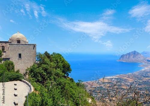 Panoramic view to Tyrrhenian coastline with Cofano mount and Church of Saint John the Baptist from Erice town, Trapani region, Sicily, Italy.