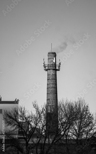 black and white winter abandoned tower with smoke
