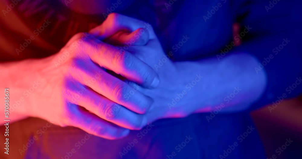 A man shows his hands in the light of police flashing lights. He demonstrates the purity of intentions. A man shows his hands in the light of police flashing lights. He demonstrates the purity of intentions.