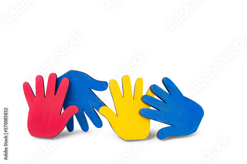 Colorfull puzzles hands on blue background. World Autism Awareness Day Concept