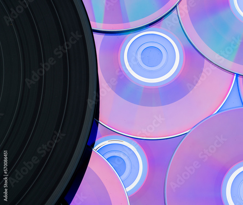 beautiful background with a vinyl record and CDs. music entertainment technology concept photo