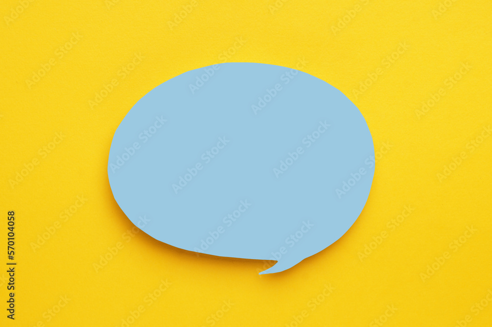 Paper speech bubble on yellow background, top view. Space for text Paper speech bubble on yellow background, top view. Space for text