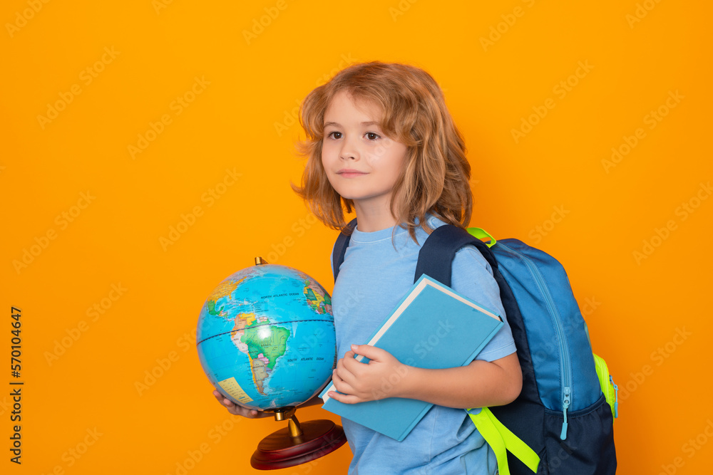 Knowledge day. Isolated portrait of cute child school boy. School and education kids concept. Clever school boy with school supplies on yellow studio background. Knowledge day. Isolated portrait of cute child school boy. School and education kids concept. Clever school boy with school supplies on yellow studio background.