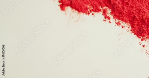 Video of red coloured powders with copy space on white background