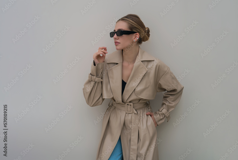 Trendy coat. Fashion boutique advertising. Fashion street style of beautiful model wearing fashion clothes. Fashion accessories. Girl vogue urban style. Trendy coat. Fashion boutique advertising. Fashion street style of beautiful model wearing fashion clothes. Fashion accessories. Girl vogue urban style.