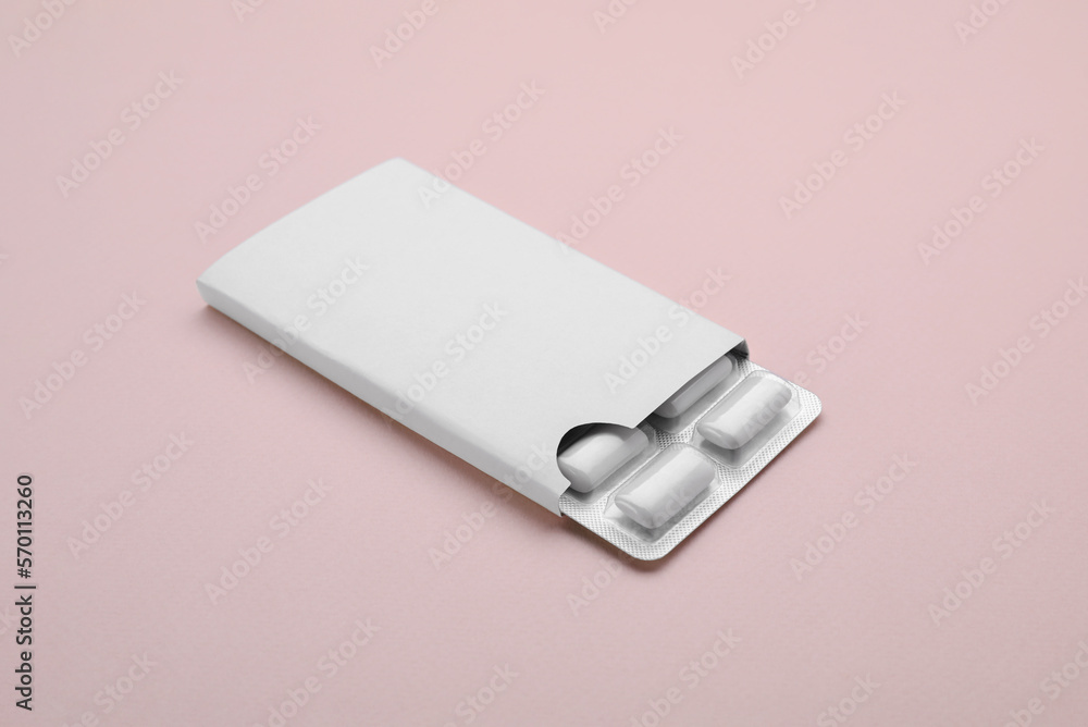 Fototapeta premium Blister with chewing gums on pink background