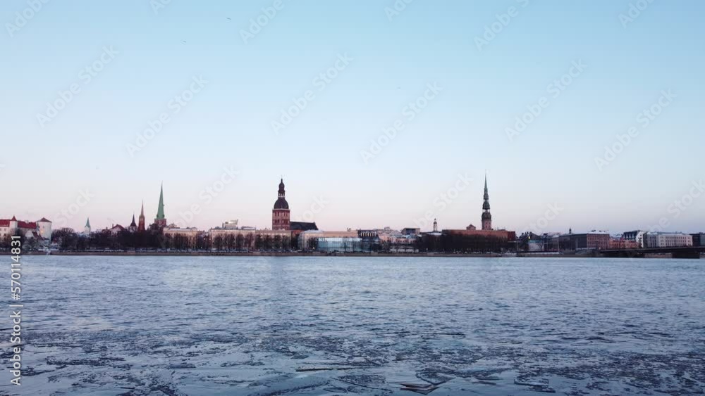 Iced frozen Daugava river in Riga, Latvia, static establisher view, dusk Iced frozen Daugava river in Riga, Latvia, static establisher view, dusk