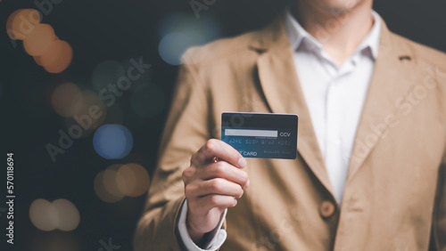 Consumers use credit cards to conduct financial transactions via the Internet,payment concept with wireless communication technology,ecommerce, digital banking and online payment concept