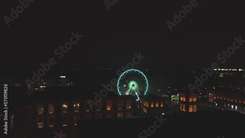 Night time Drone video of a Ferris wheel in manufaktura lodz poland photo