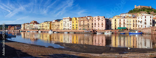 River with Homes and Apartments in Touristic Town. Bosa, Sardinia, Italy. Sunny Fall Season Day. Panorama © edb3_16