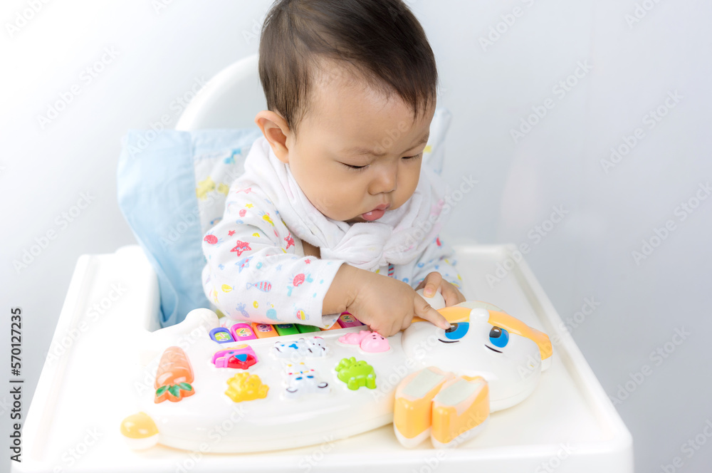 Baby sitting play in high chair,happiness baby,asian baby boy Baby sitting play in high chair,happiness baby,asian baby boy