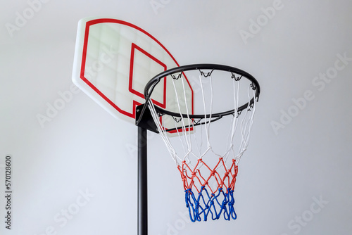 Isolated on white background is basketball basket hoop with rim and net