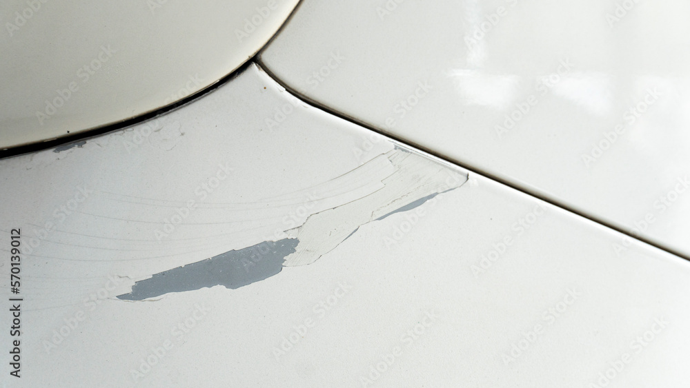 Paint scratches of white cars on the side of the car. Background of an ...