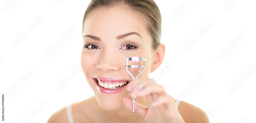 Eye makeup woman using eyelashes curler for mascara. Eyelash face care beauty girl smiling happy. Multiracial Asian Chinese / Caucasian female model looking in mirror isolated in transparent PNG. Eye makeup woman using eyelashes curler for mascara. Eyelash face care beauty girl smiling happy. Multiracial Asian Chinese / Caucasian female model looking in mirror isolated in transparent PNG.