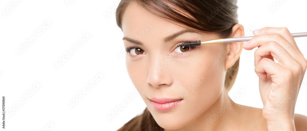 Beauty makeup woman putting mascara eye make up on eyes. Asian fresh face girl looking in the mirror looking at camera isolated in transparent PNG. Mixed race ethnic Asian Chinese / Caucasian model. Beauty makeup woman putting mascara eye make up on eyes. Asian fresh face girl looking in the mirror looking at camera isolated in transparent PNG. Mixed race ethnic Asian Chinese / Caucasian model.