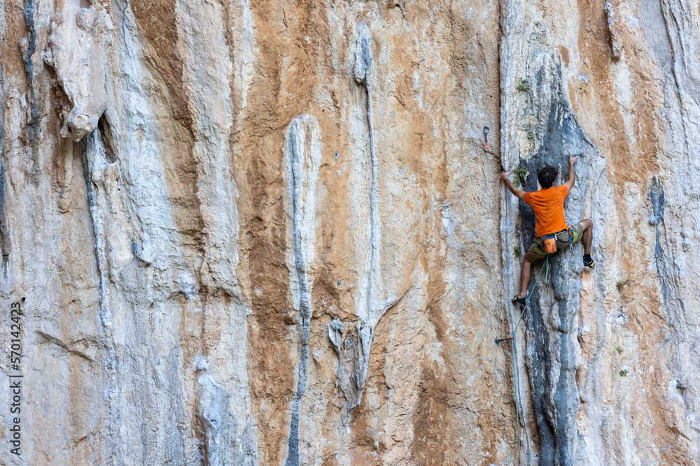 rock climber climbs the route. rock climber climbs the route.