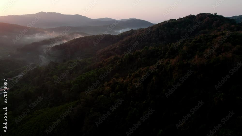 Top view Landscape of Morning Mist with Mountain Layer at north of Thailand. mountain ridge and clouds in rural jungle bush forest Top view Landscape of Morning Mist with Mountain Layer at north of Thailand. mountain ridge and clouds in rural jungle bush forest