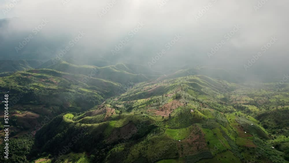 Top view Landscape of Morning Mist with Mountain Layer at north of Thailand. mountain ridge and clouds in rural jungle bush forest Top view Landscape of Morning Mist with Mountain Layer at north of Thailand. mountain ridge and clouds in rural jungle bush forest