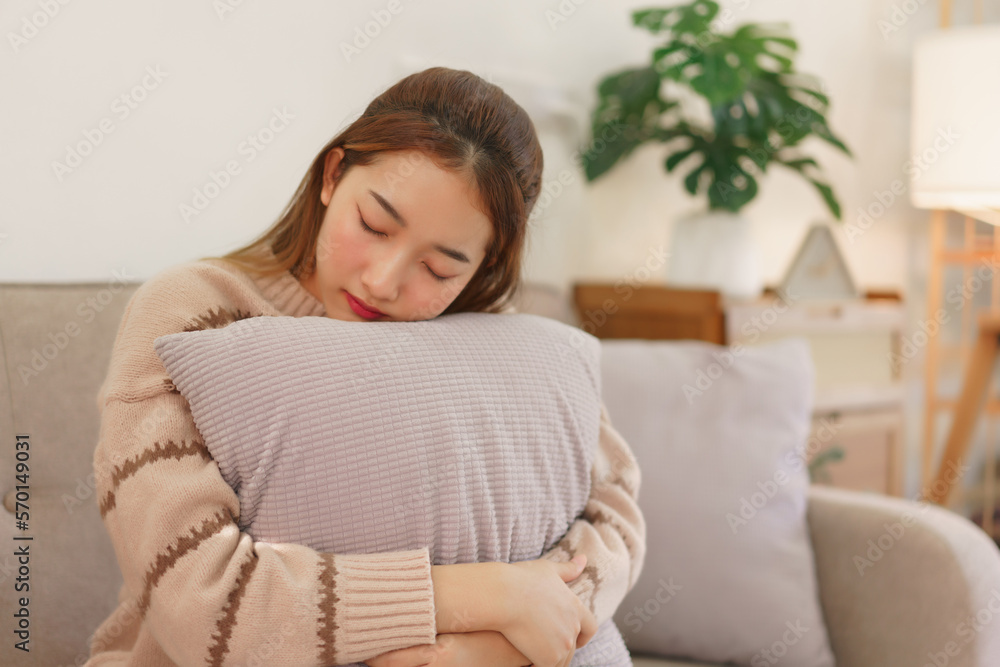 Leisure time concept, Women are hugging pillow and asleep while sitting on the couch to relaxation Leisure time concept, Women are hugging pillow and asleep while sitting on the couch to relaxation