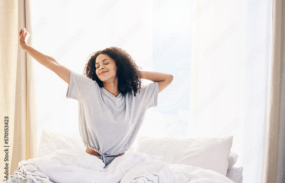 Black woman, morning stretching and waking up in home bedroom after  sleeping or resting. Relax, peace