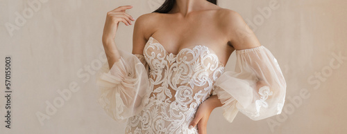 Fotografie Beautiful bride with the naked shoulders dressed in the white wedding dress