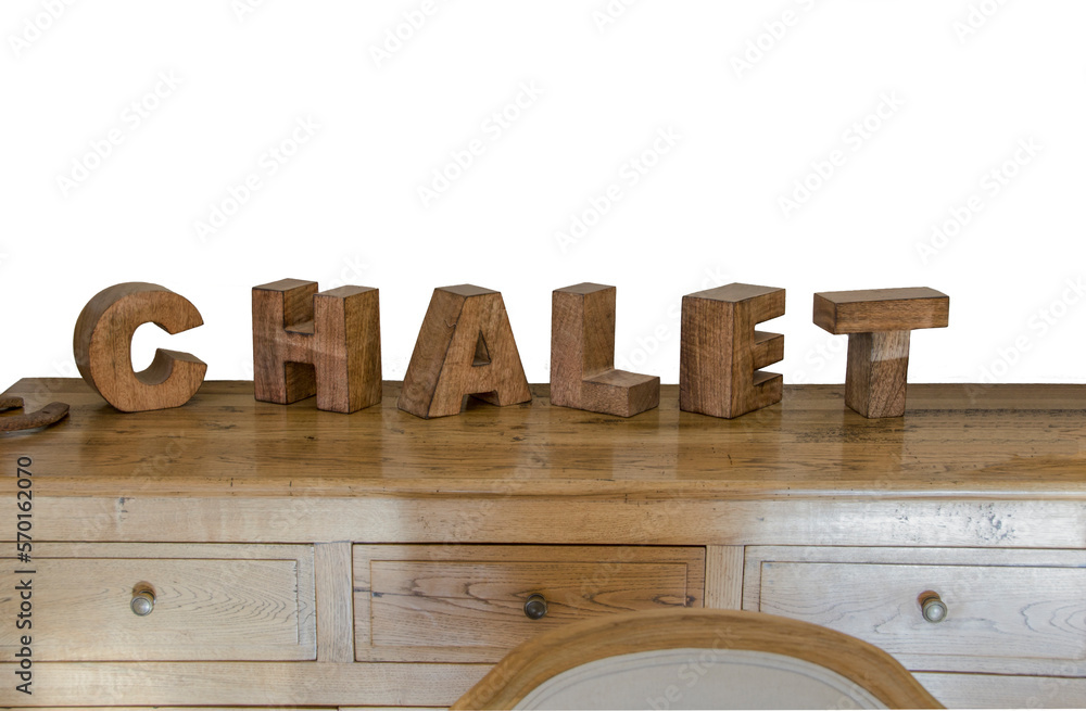 wooden cubes forming the word Chalet, placed on a furniture and used