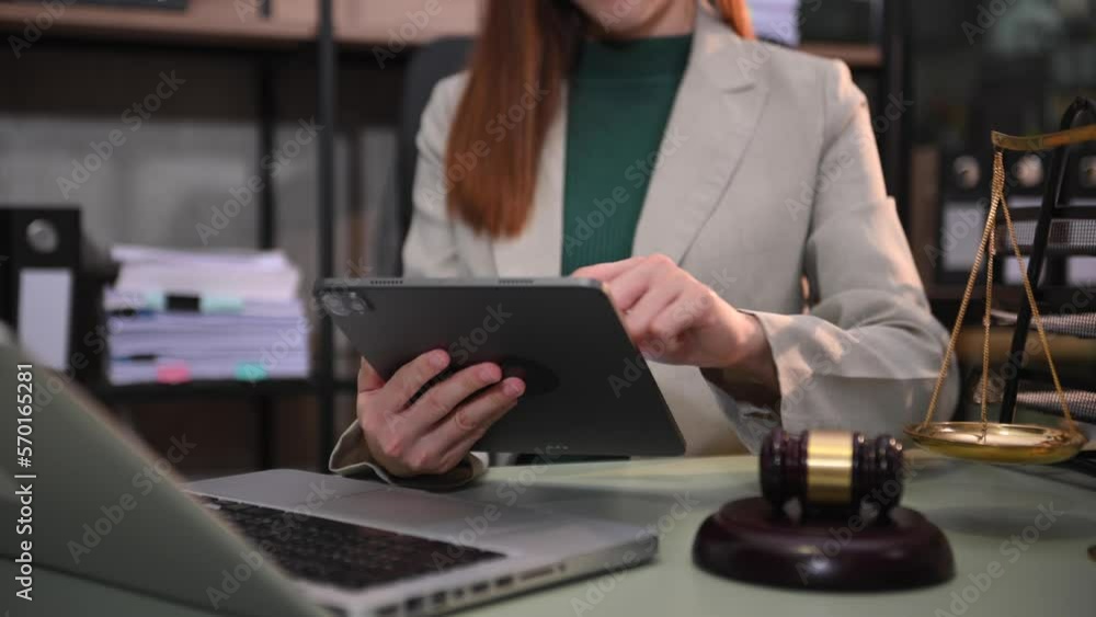 justice and law concept.Male judge in a courtroom the gavel, working with smart phone and laptop and digital tablet computer on wood table in morning light . justice and law concept.Male judge in a courtroom the gavel, working with smart phone and laptop and digital tablet computer on wood table in morning light .