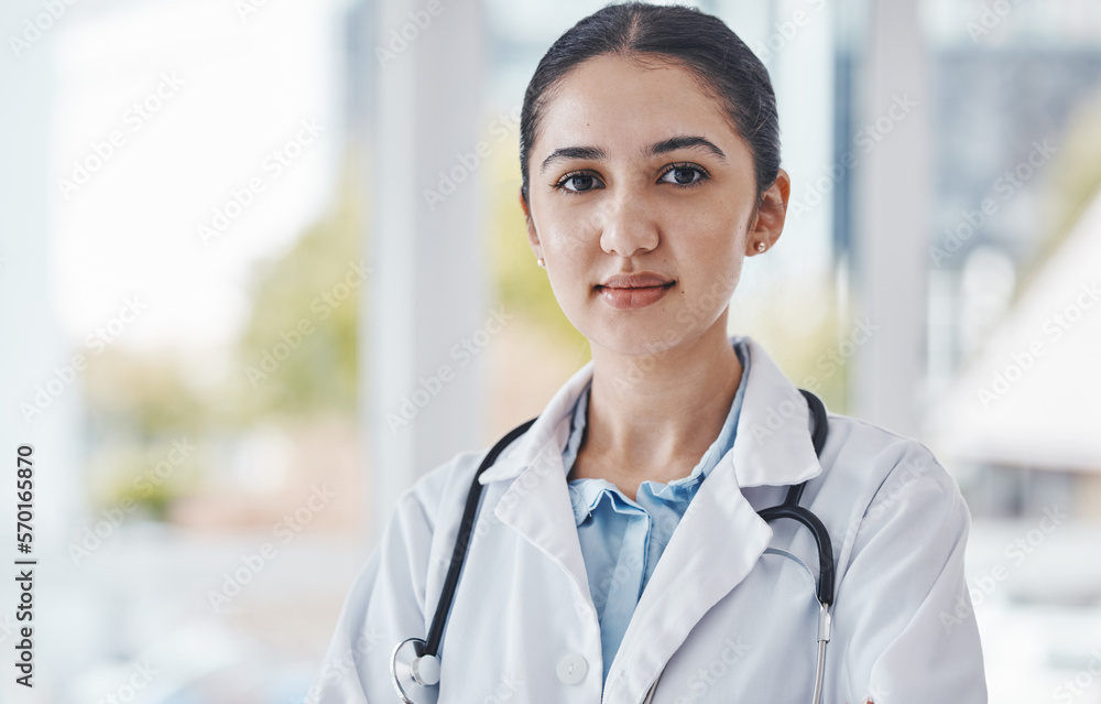 Leader, female and portrait of a doctor in the hospital after a healthcare consultation. Confident, young and proud professional woman medical worker standing in a medicare clinic after a checkup. Leader, female and portrait of a doctor in the hospital after a healthcare consultation. Confident, young and proud professional woman medical worker standing in a medicare clinic after a checkup.