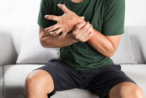 Acute pain in a asian man wrist. photo