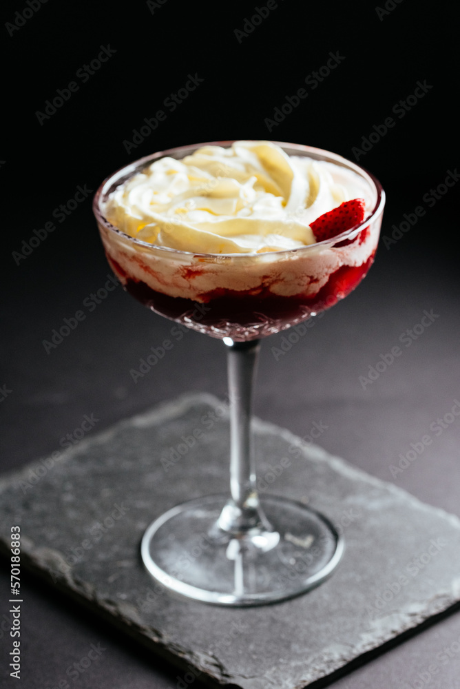 glass of alcoholic coctail with ice on black background glass of alcoholic coctail with ice on black background