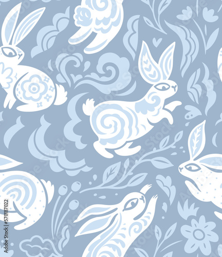 Seamless vector pattern with silhouettes of rabbits with leaves and oriental motifs