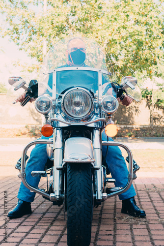 front view of custom chopper motorcycle with biker