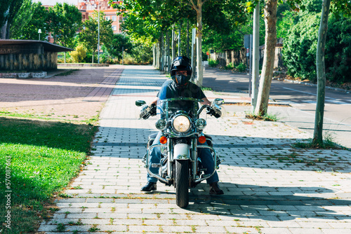 front view of custom chopper motorcycle with biker