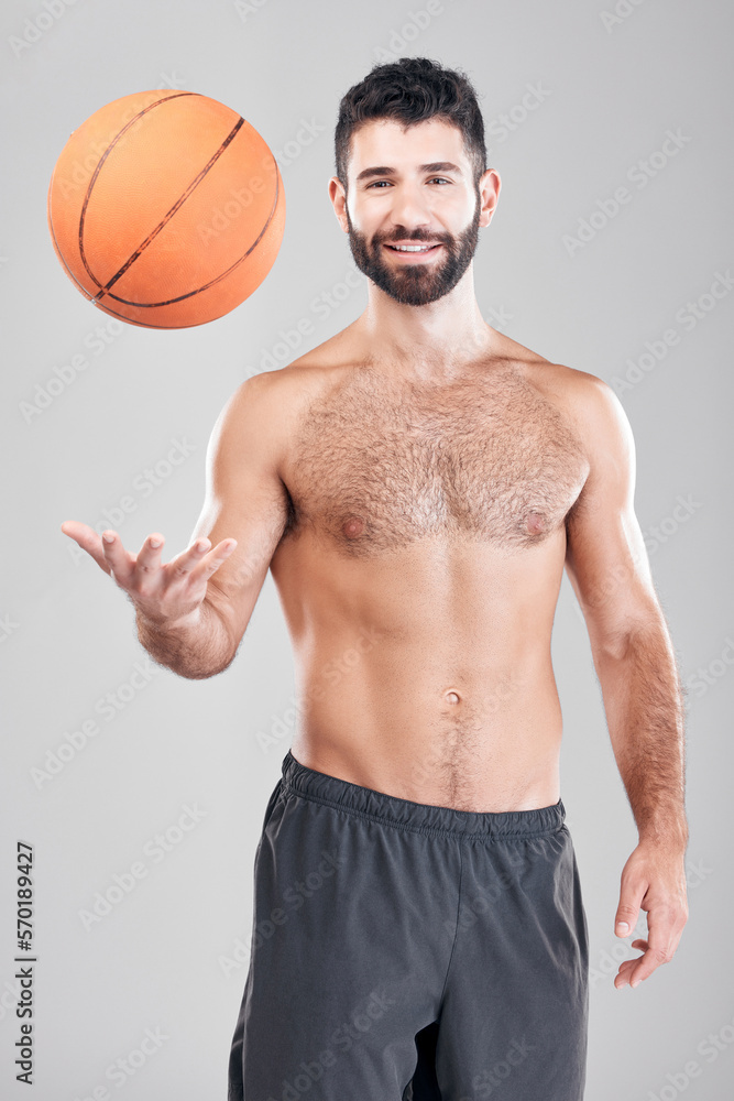 Fitness, portrait of man throwing basketball in air and smile, topless and isolated on grey background. Exercise, motivation and ball sports coach or personal trainer with workout mindset in studio. Fitness, portrait of man throwing basketball in air and smile, topless and isolated on grey background. Exercise, motivation and ball sports coach or personal trainer with workout mindset in studio.