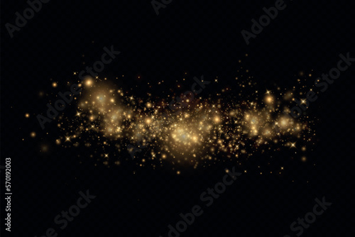 Golden glitter.Light effect.Glittering particles background. Gold dust on a transparent background.