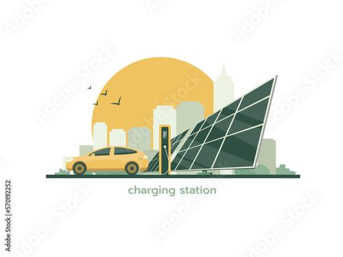 Electric car is charging. Charging station and solar panels on the background of the cityscape.