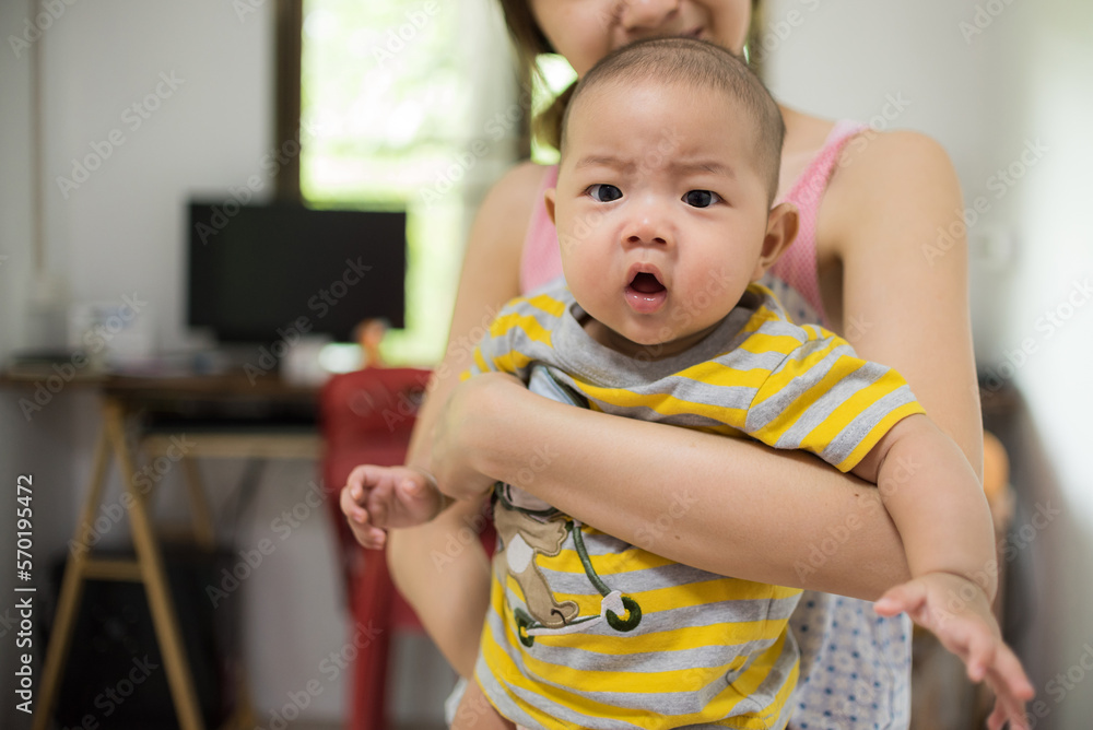 Asia mother playing with baby boy in home Asia mother playing with baby boy in home