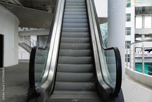 modern luxury escalator with stairs in the building