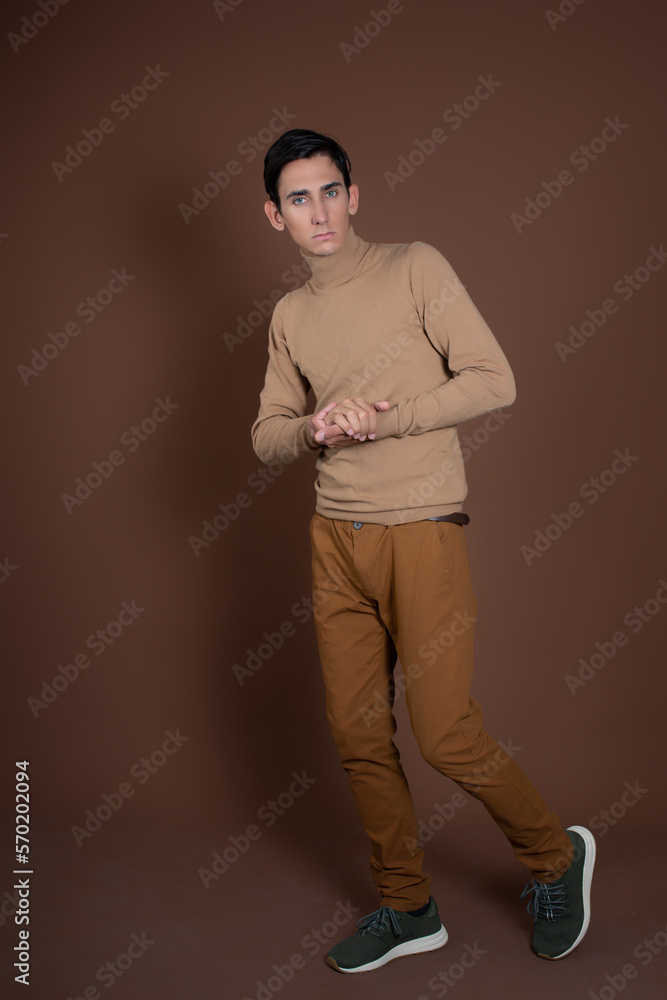 Fotografie Young attractive guy fooling around in the studio