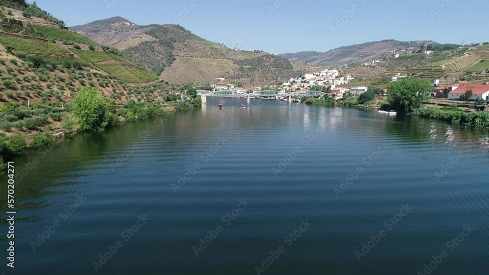 typical portuguese boats sailing on the river from Aerial View typical portuguese boats sailing on the river from Aerial View
