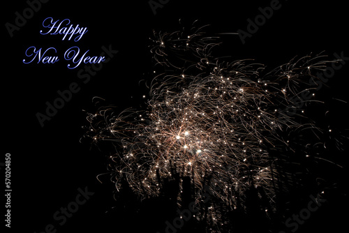 Real fireworks photography and abstract colorful fireworks background with Happy New Year lettering