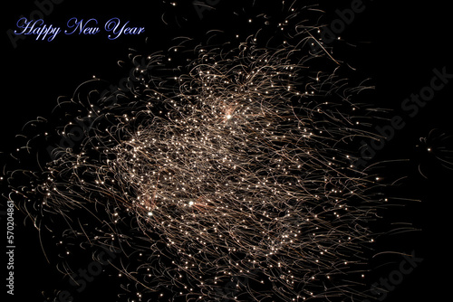 Real fireworks photography and abstract colorful fireworks background with Happy New Year lettering