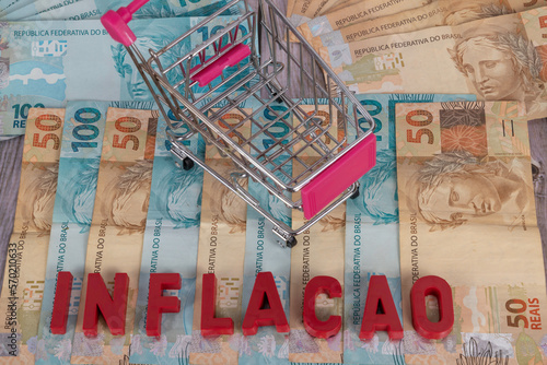 Brazilian banknotes. Banknotes of 50 and 100 reais in the background with the word 