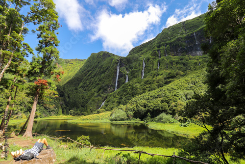 Hikers enjoy the silence with the view of the idyllic lagoon and waterfalls Poço da Alagoinha on the island of Flores in the Azores.
What a paradise!
Flores, Azores - in the Atlantic Ocean photo