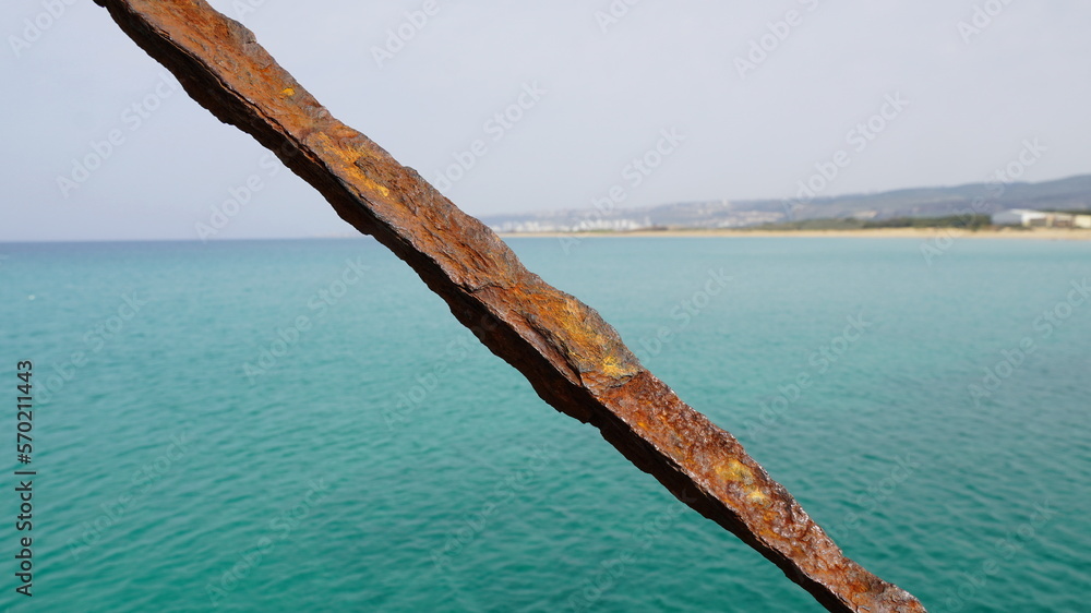 Rusty part of shipwreck. An iron piece from a ship on the seashore Rusty part of shipwreck. An iron piece from a ship on the seashore