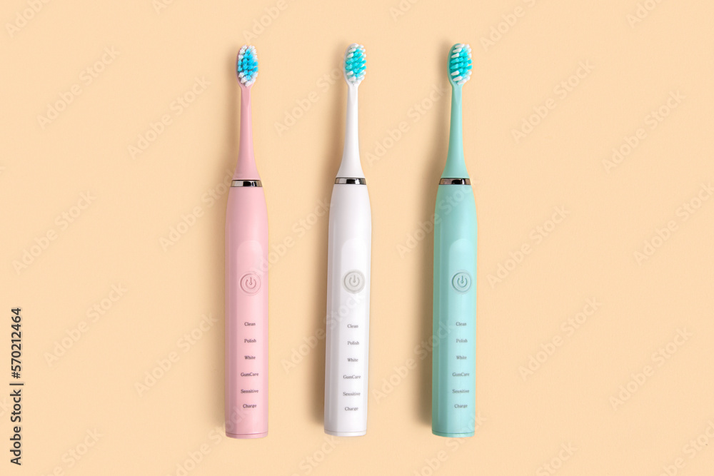 Electric Toothbrush. Top View, Flat Lay, Copy Space. Dental Care Supplies on Beige Pastel Studio Background. Oral Hygiene, Gum Health, Healthy Teeth. Modern Dental Ultrasonic Vibration Tooth Brush Set Electric Toothbrush. Top View, Flat Lay, Copy Space. Dental Care Supplies on Beige Pastel Studio Background. Oral Hygiene, Gum Health, Healthy Teeth. Modern Dental Ultrasonic Vibration Tooth Brush Set
