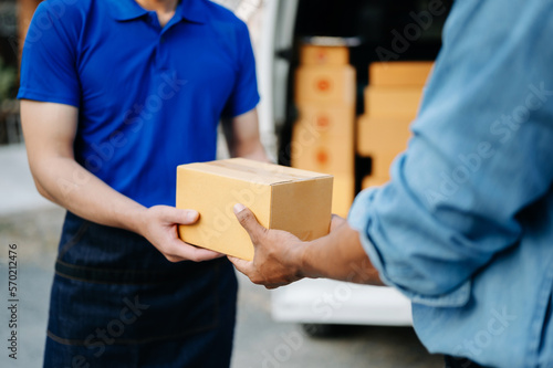 Parcel delivery and a name tag is delivering parcels to a client. Friendly worker, high quality delivery service. and shipping ..